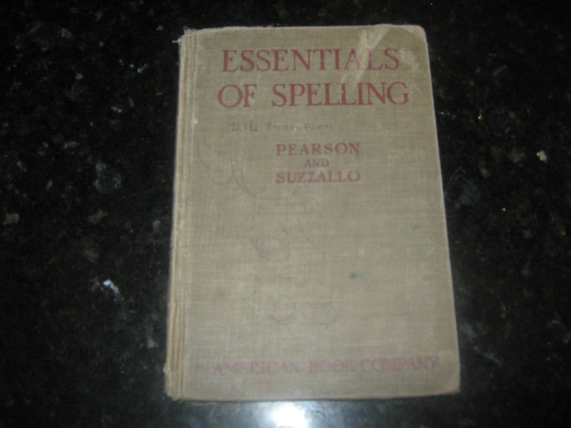 1919 Essentials of Spelling, slight water damage to cover, pages are fine